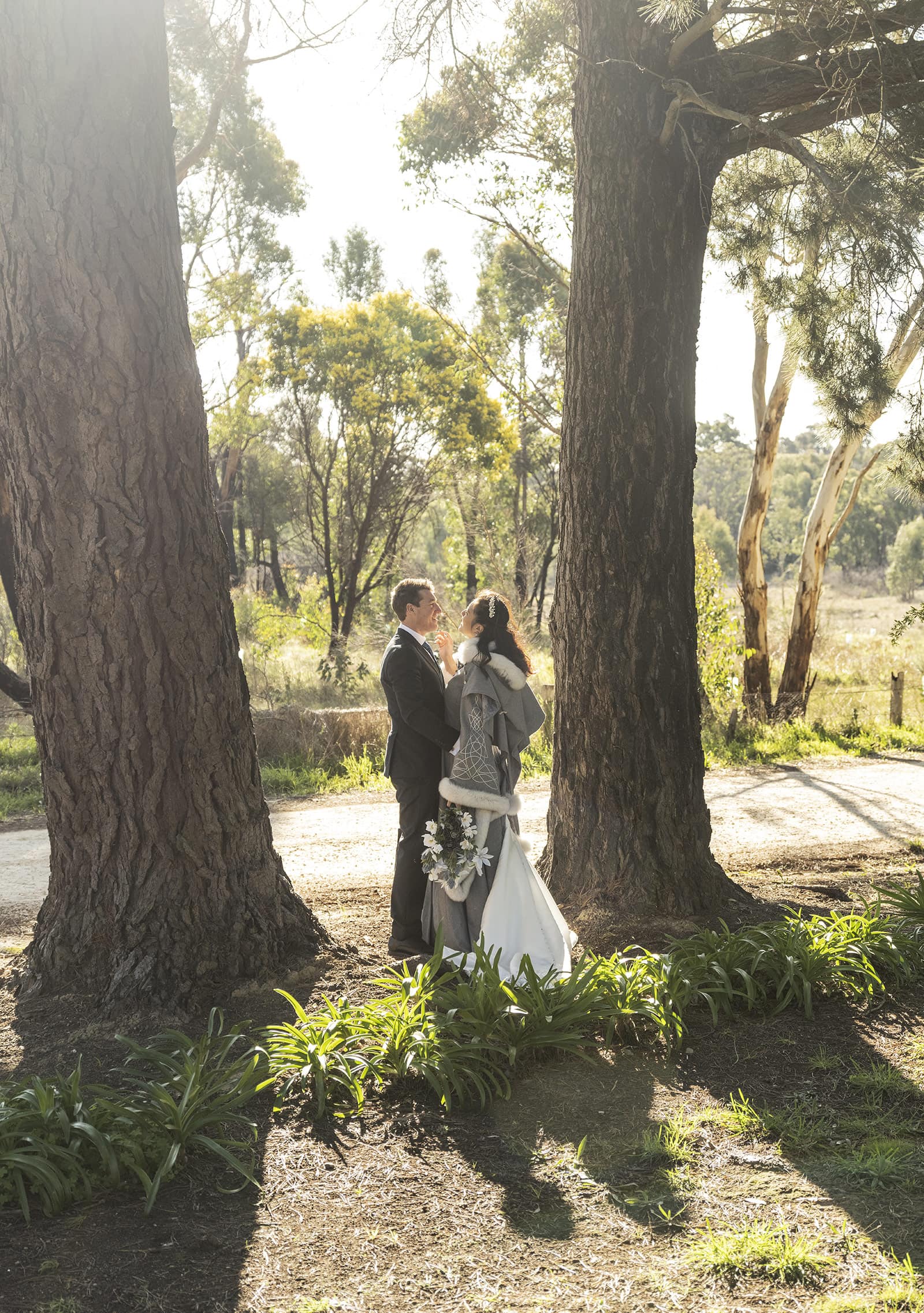 mount torrens hotel wedding - clare & craig 59 bride ad groom in between two trees