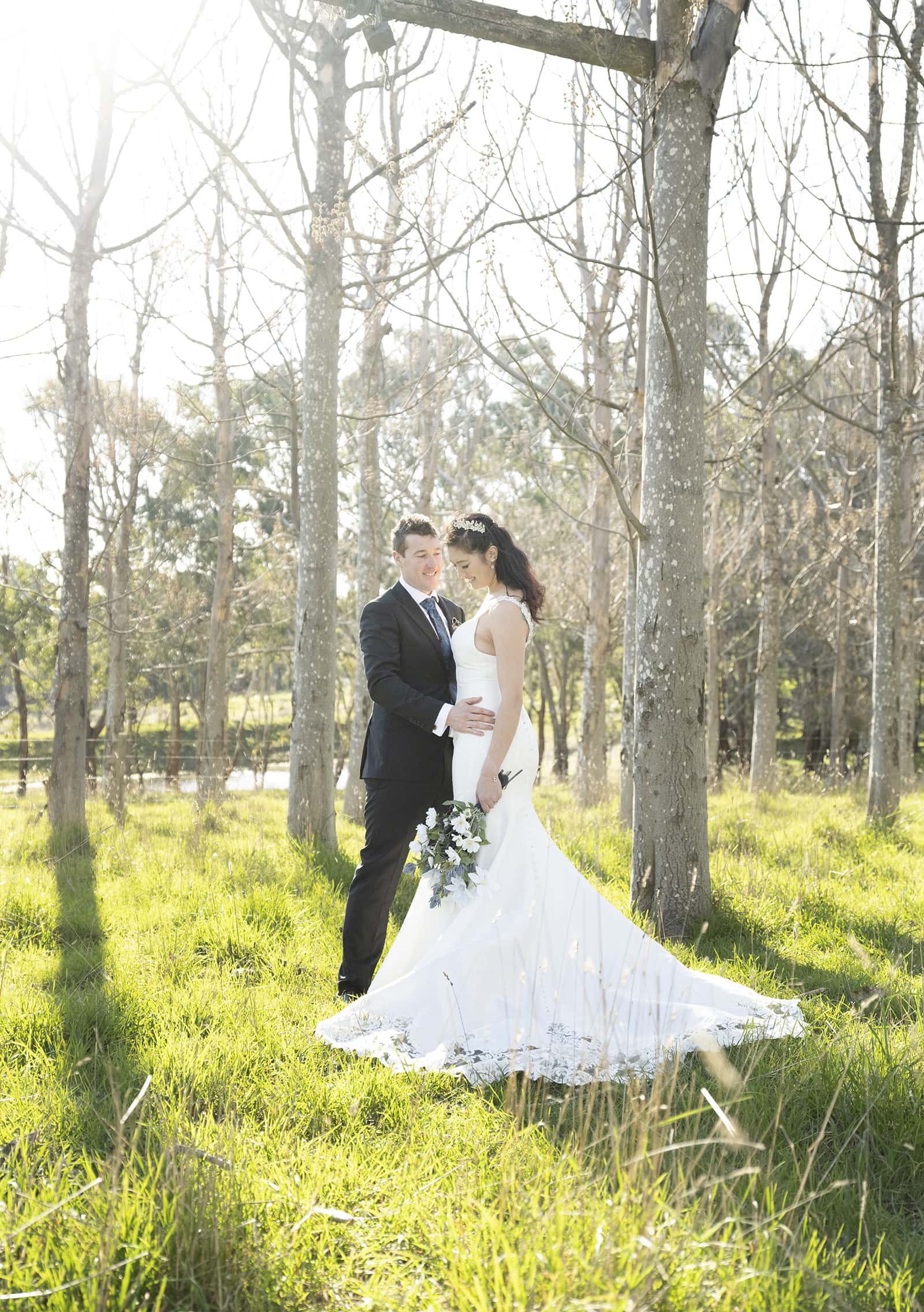 mount torrens hotel wedding - clare & craig 63 Bride and groom backdropped by sunlight