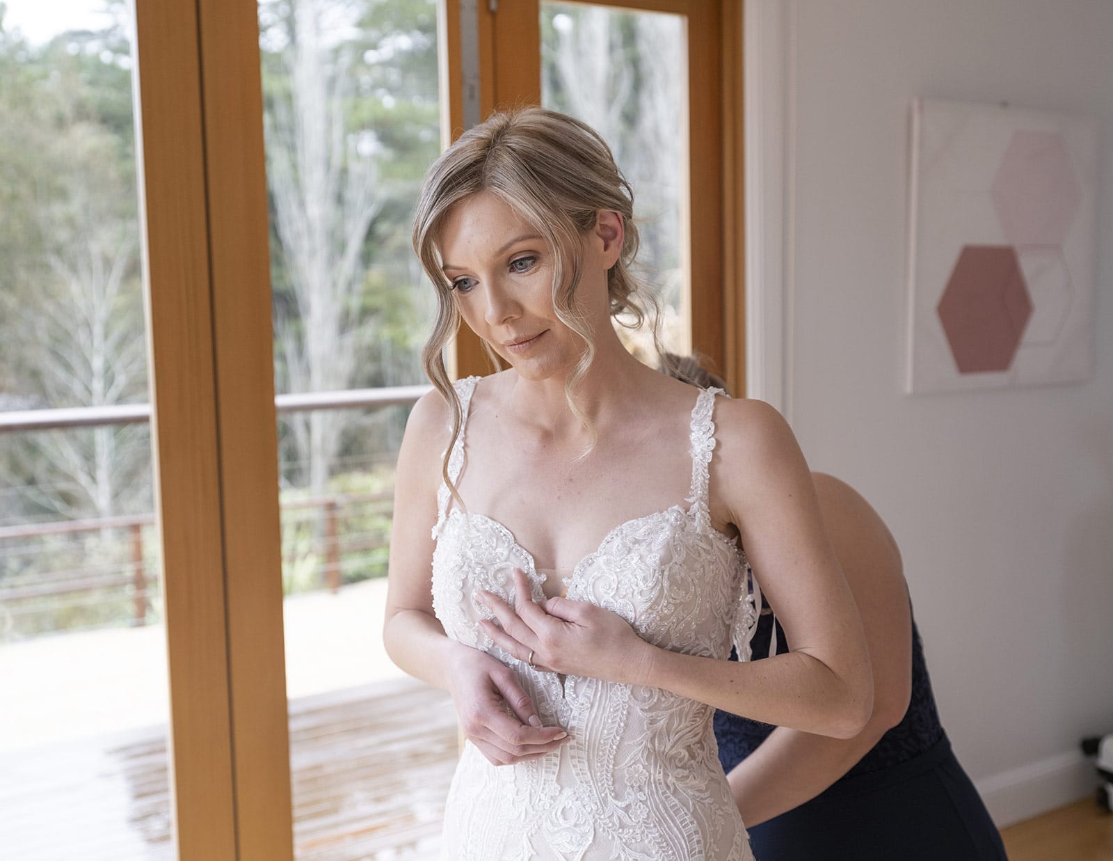 mount lofty house wedding - katrina & lucas 18 Bride having her gown put on