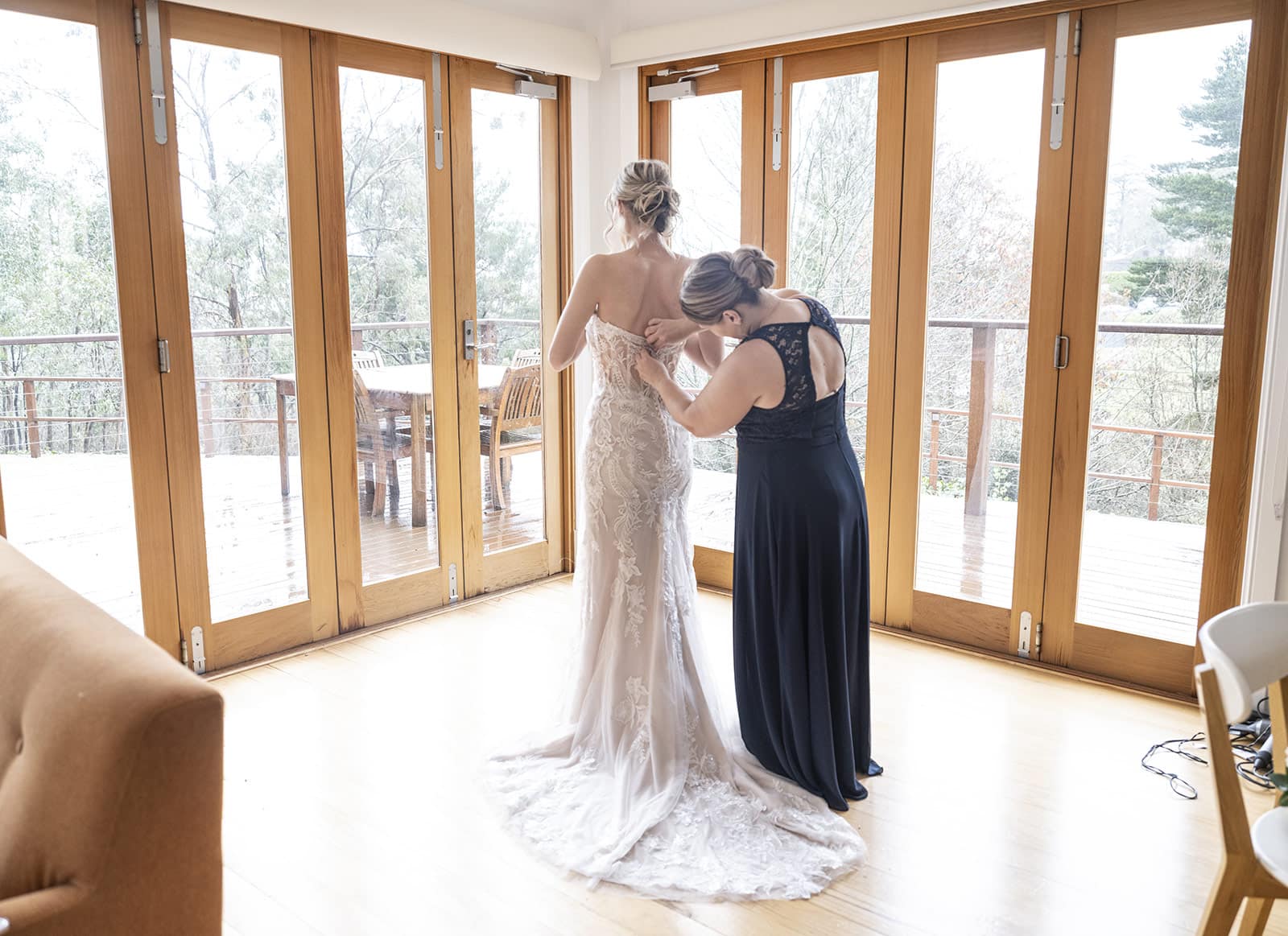 mount lofty house wedding - katrina & lucas 17 Helping put on bridal gown