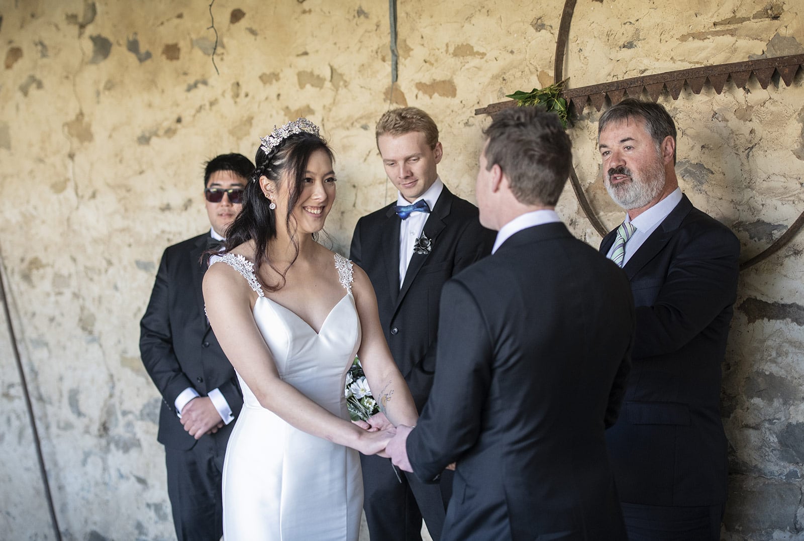 mount torrens hotel wedding - clare & craig 37 Holding hands during ceremony at Mount Torrens hotel wedding