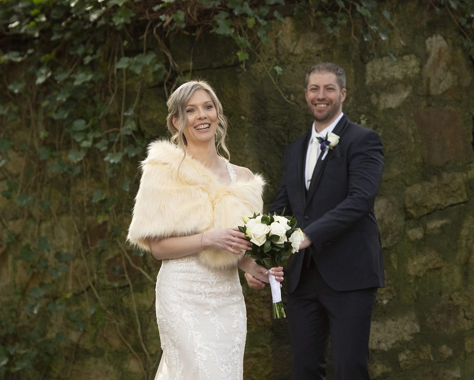 mount lofty house wedding - katrina & lucas 50 Smiling bride and groom next to wall