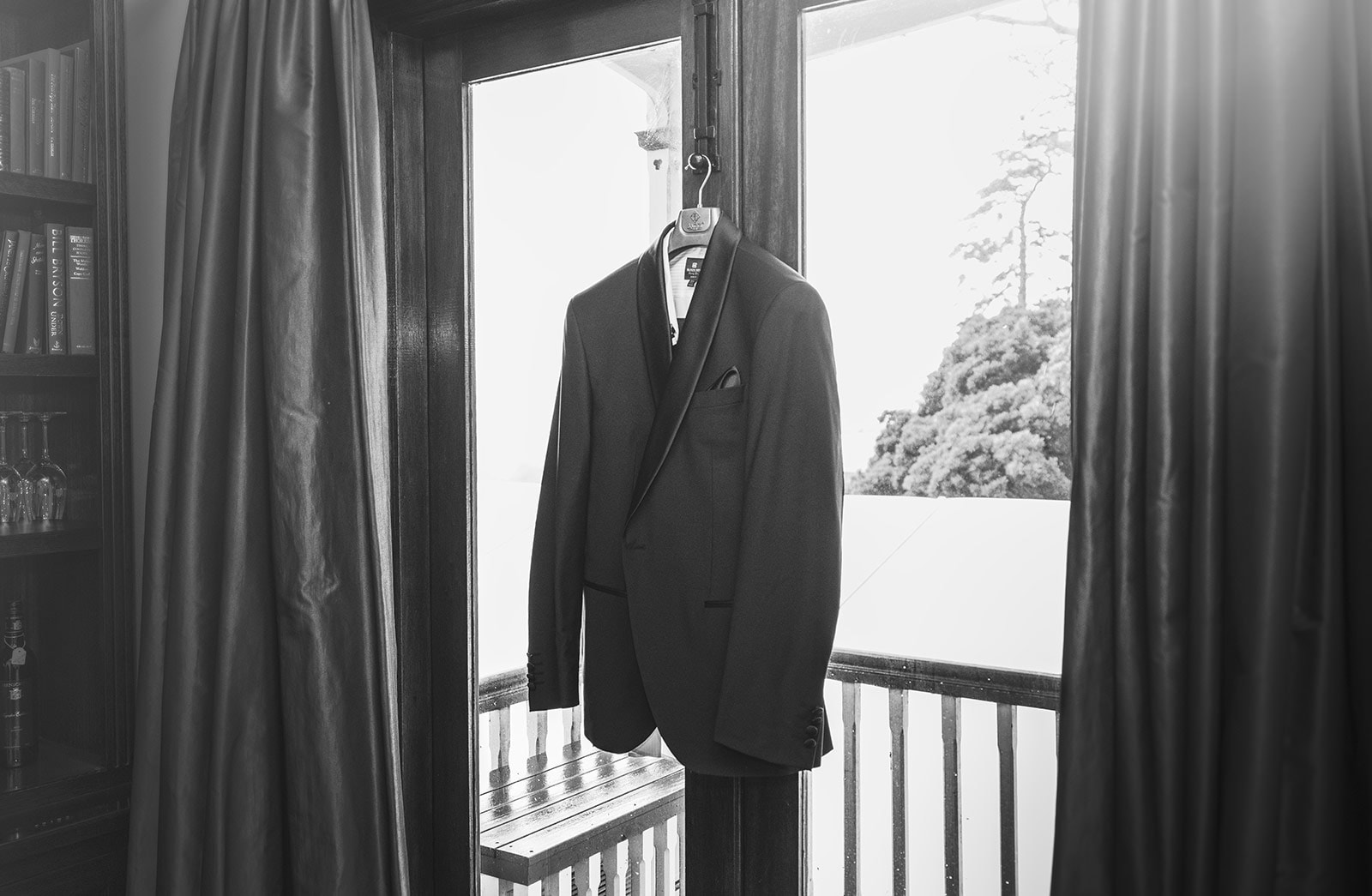 mount lofty house wedding - katrina & lucas 3 Suit hanging on door frame