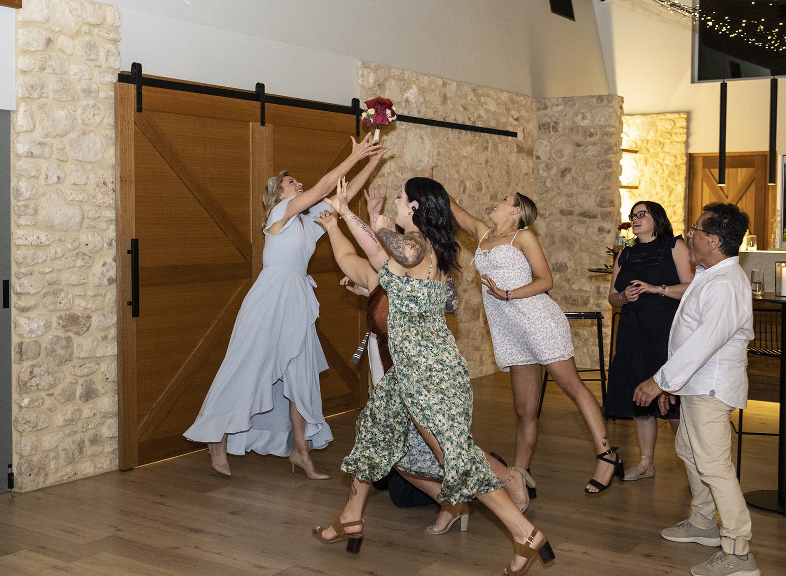lake breeze wines wedding - cate & renato 58 Bouquet toss at Lake Breeze wines wedding