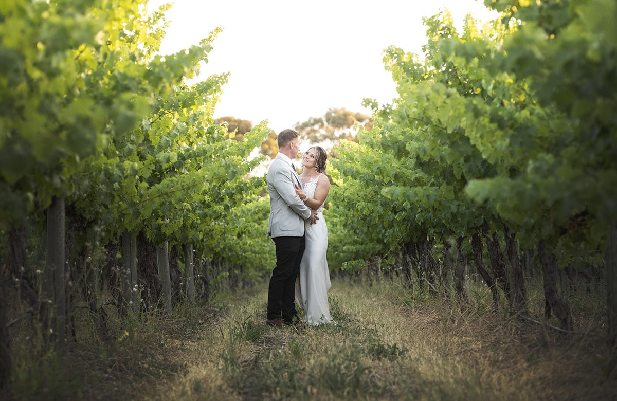big easy radio wedding - leanne & evan 57 Bride and groom in amngst the Big Easy Radio vineyards