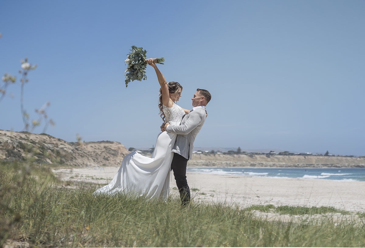 big easy radio wedding - leanne & evan 18 Bride and groom in the beach grass