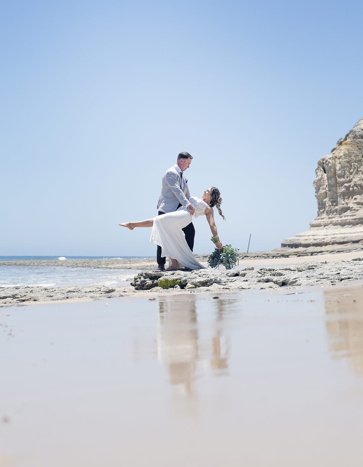 big easy radio wedding - leanne & evan 20 Bride and groom practicing their dance on the beach