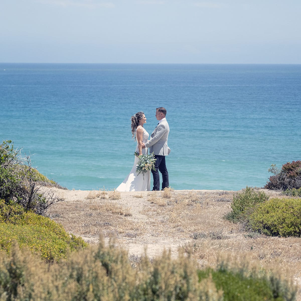 big easy radio wedding - leanne & evan 22 Bride and groom with beach in background