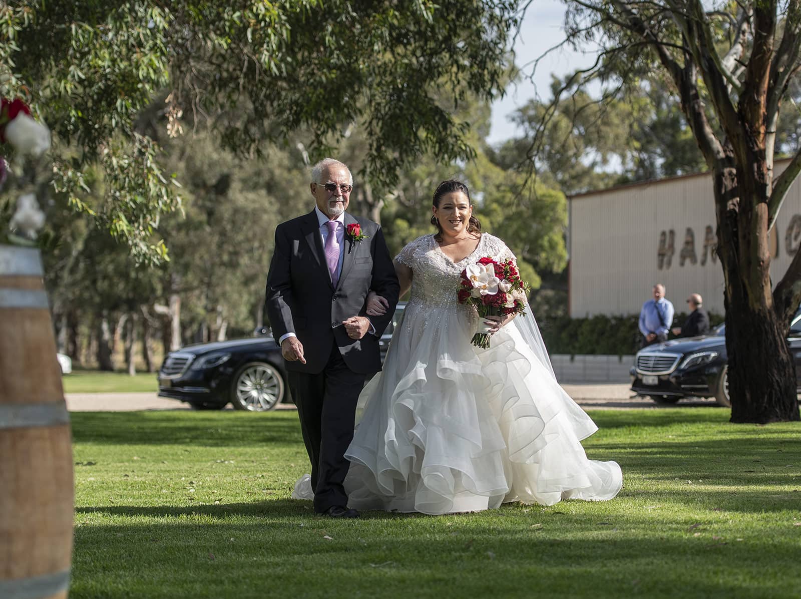 lake breeze wines wedding - cate & renato 26 Bride being escorted down aisle