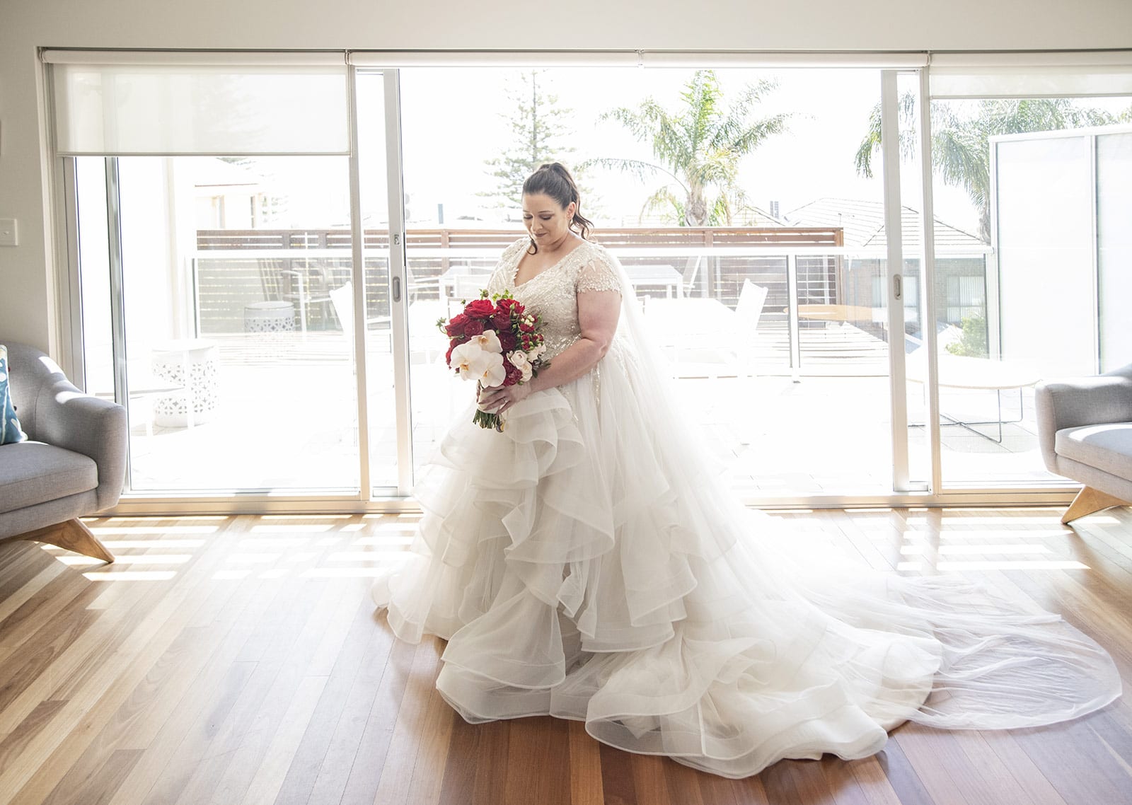 lake breeze wines wedding - cate & renato 19 bride in sunlight