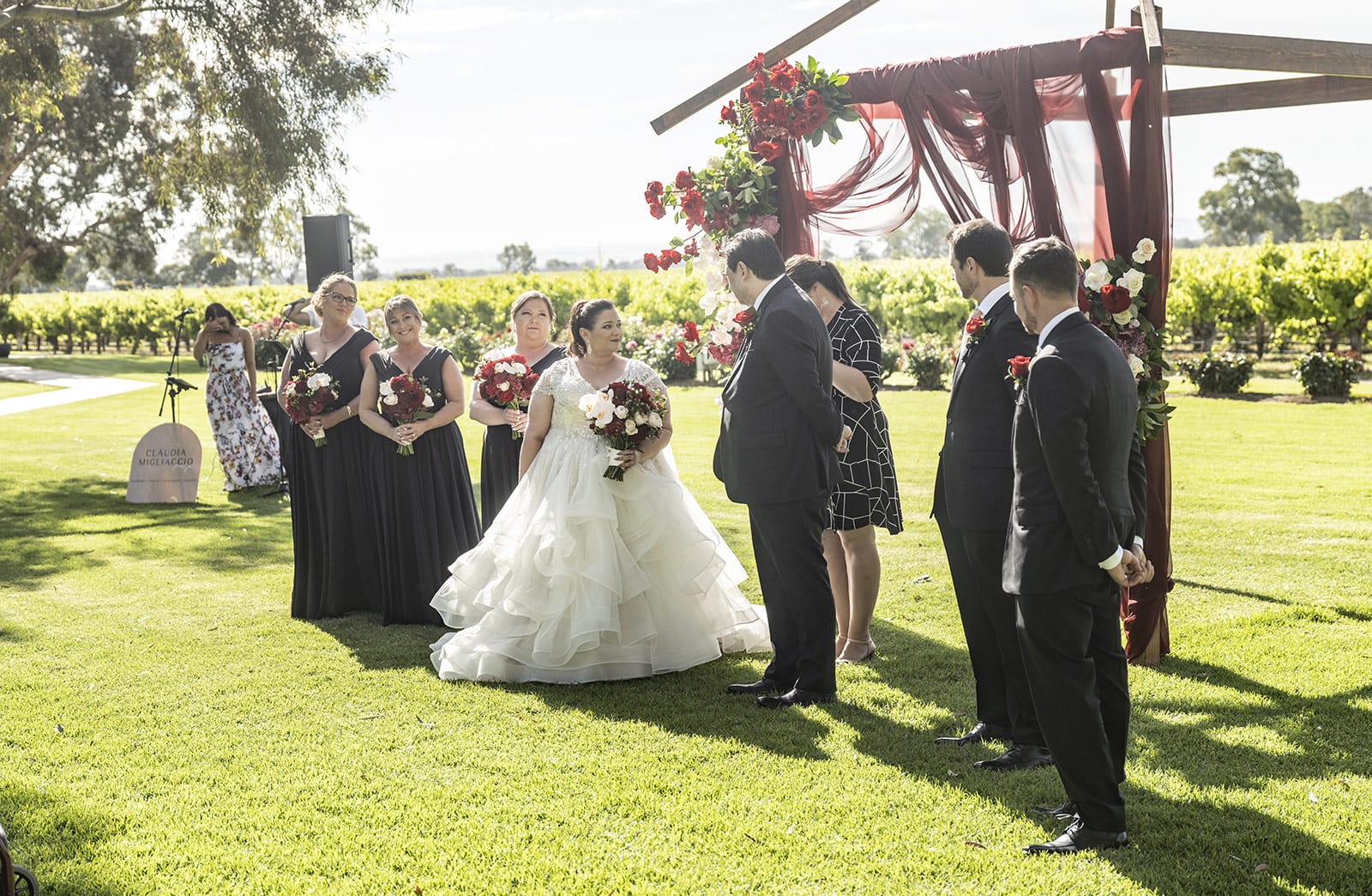 lake breeze wines wedding - cate & renato 28 Bride out the front of wedding ceremony
