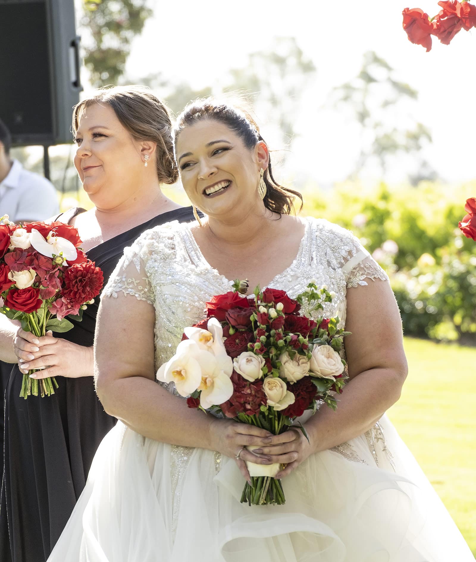lake breeze wines wedding - cate & renato 30 Bride smiling during wedding ceremony