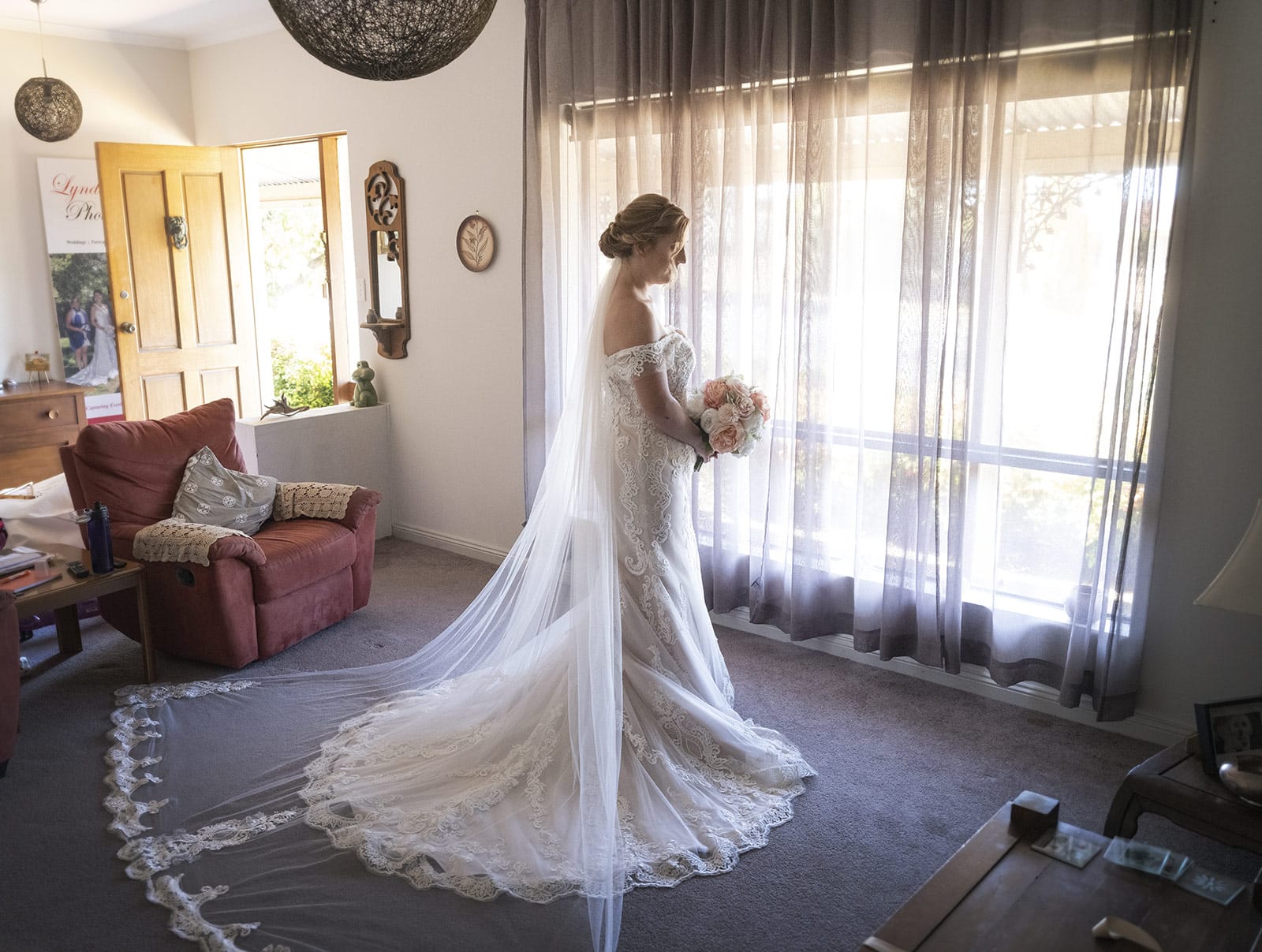 coriole wines wedding - marielle & brendan 16 Bride standing in window