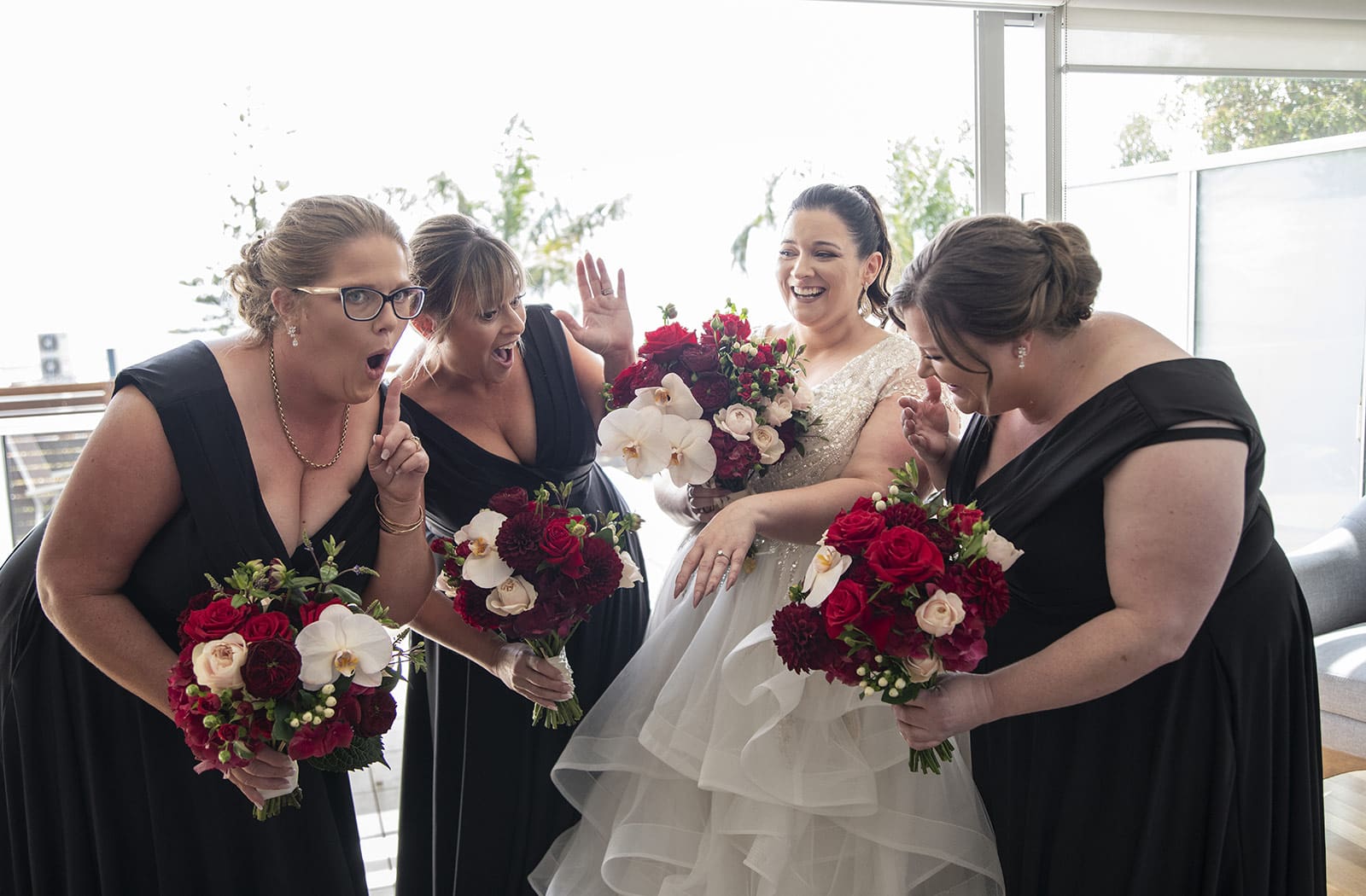 lake breeze wines wedding - cate & renato 21 Bridesmaids reacting to engagement ring