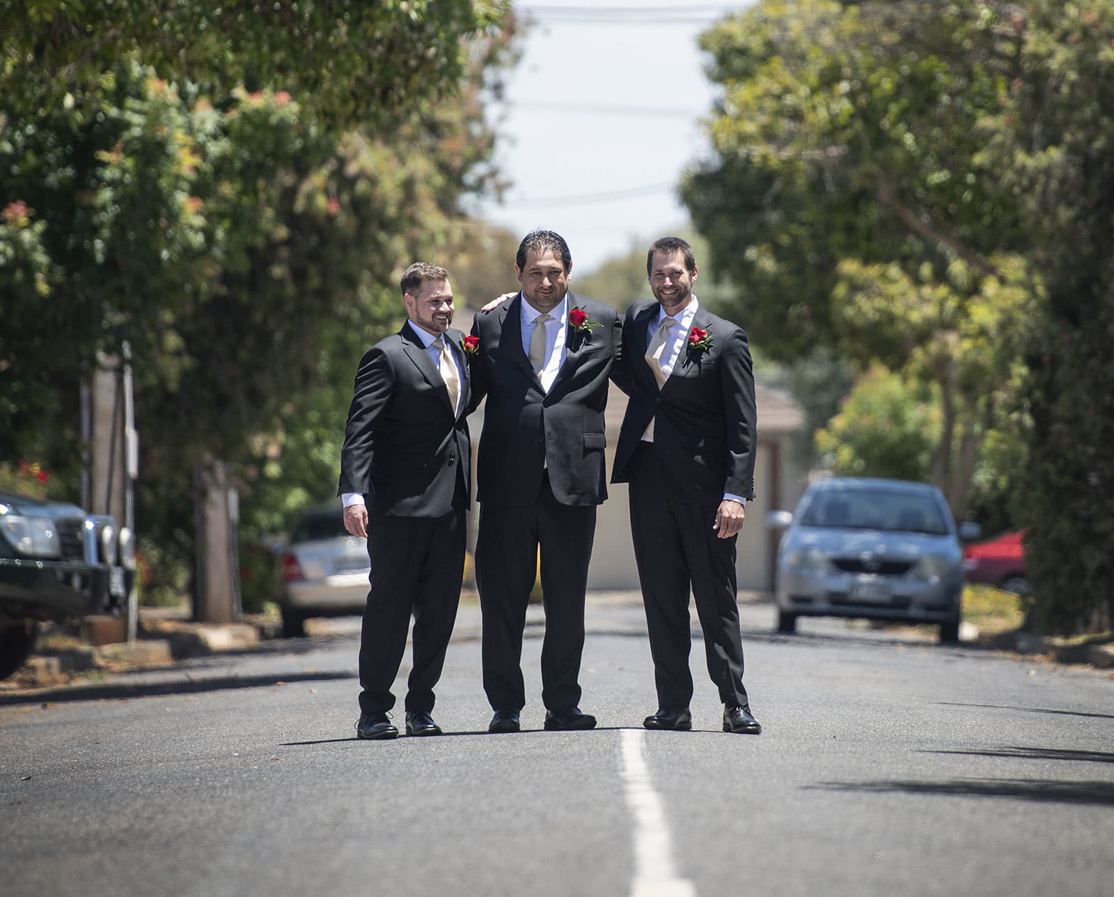 lake breeze wines wedding - cate & renato 6 Groom and groomsmen together on road