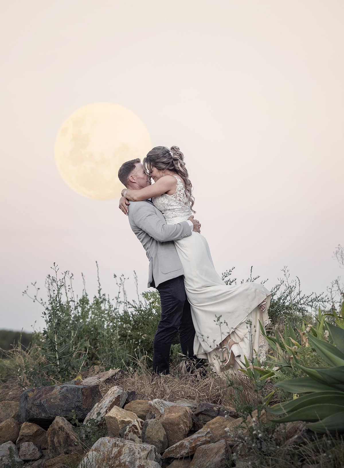 big easy radio wedding - leanne & evan 63 Groom lifting his bride under full moon