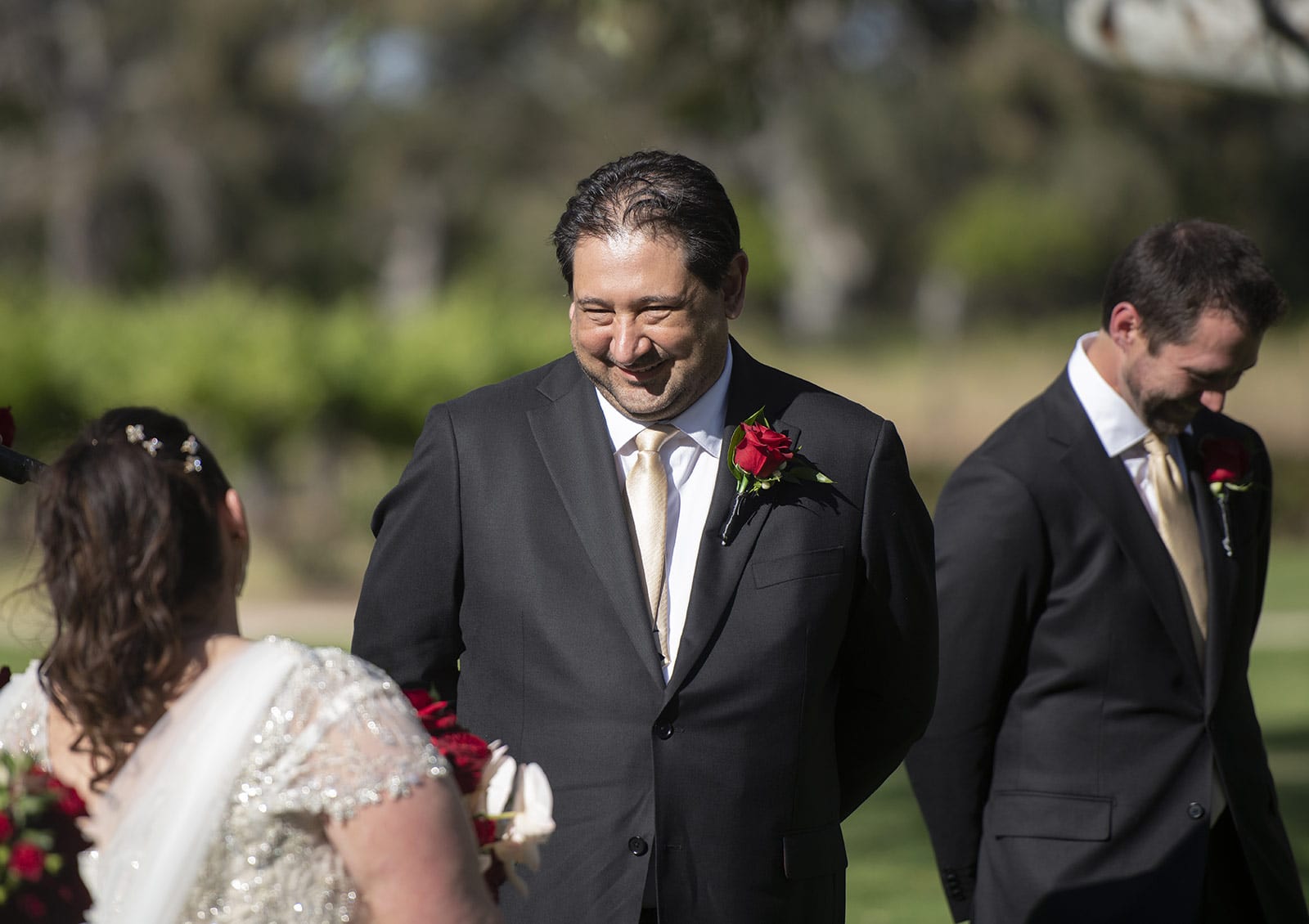 lake breeze wines wedding - cate & renato 31 Groom smiling during wedding ceremony