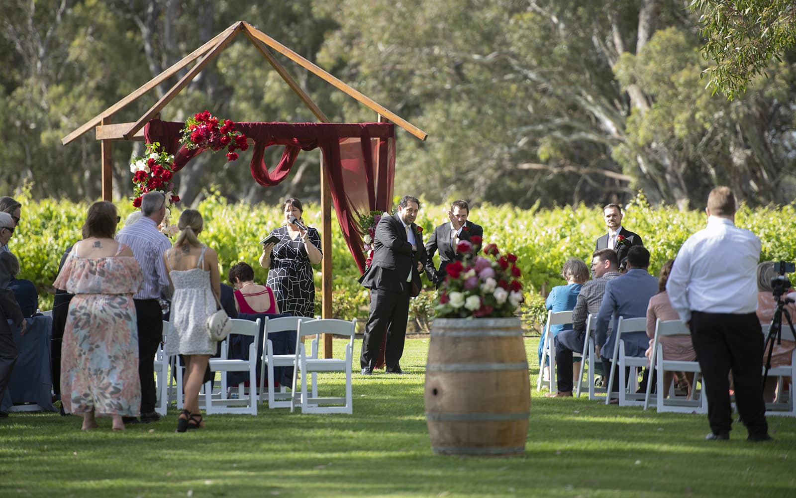 lake breeze wines wedding - cate & renato 24 groom waiting for his bride to arrive