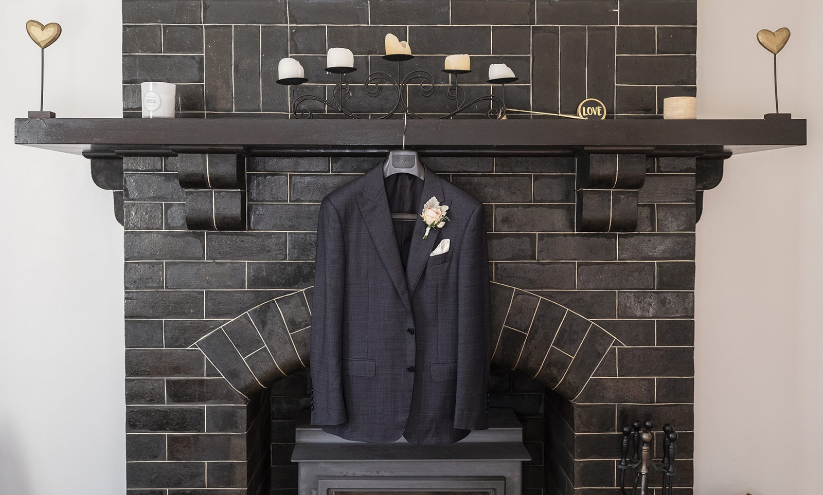 coriole wines wedding - marielle & brendan 4 grooms suit jacket on fireplace