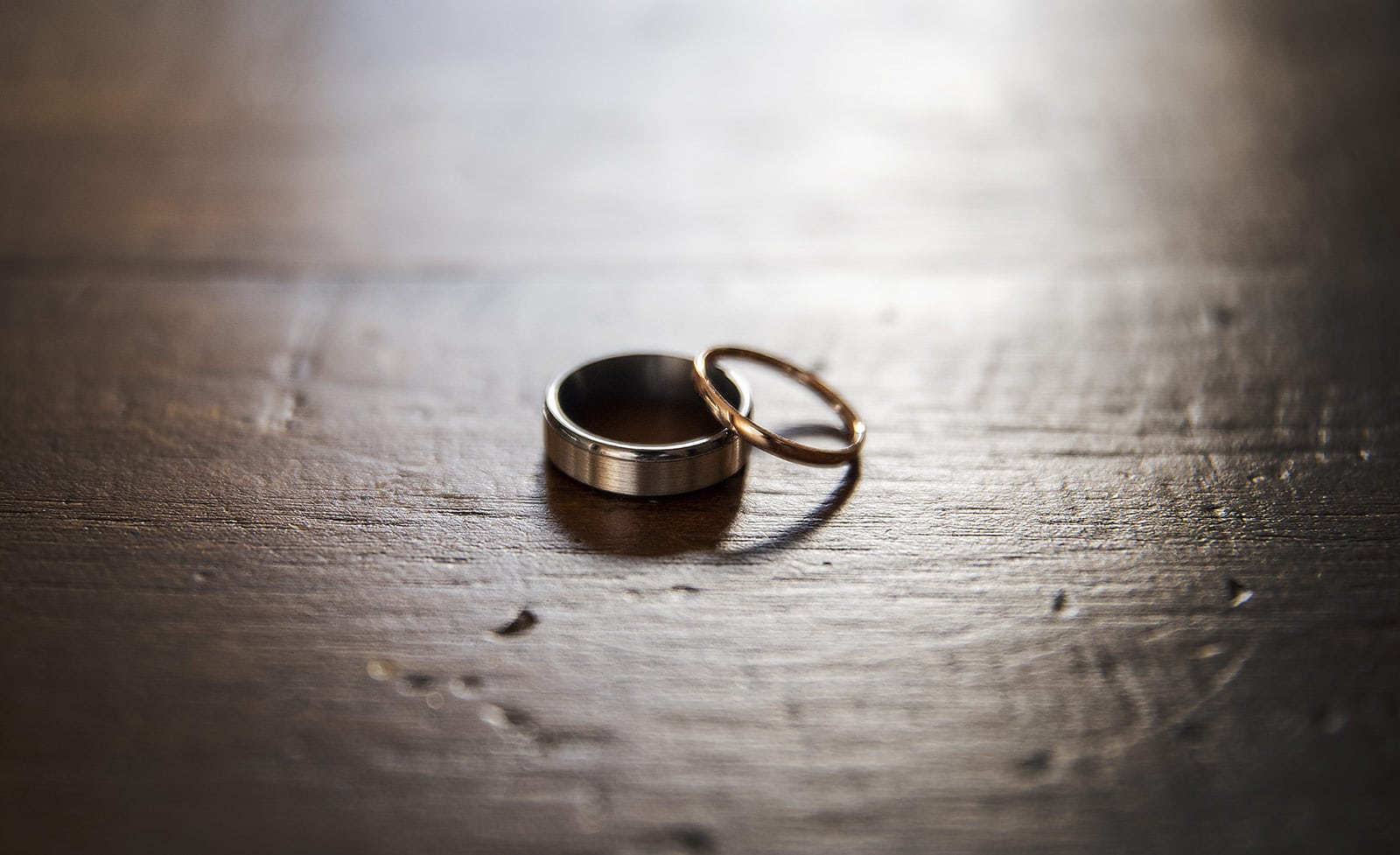 coriole wines wedding - marielle & brendan 2 Wedding rings on wooden table