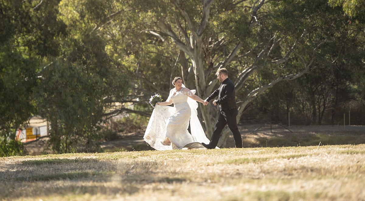 Bride leading groom on merry jape