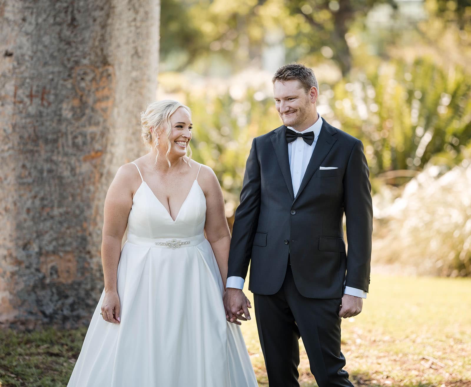 adelaide botanic gardens cycad collection wedding - joanne & blake 16 Bride and groom holding hands smiling
