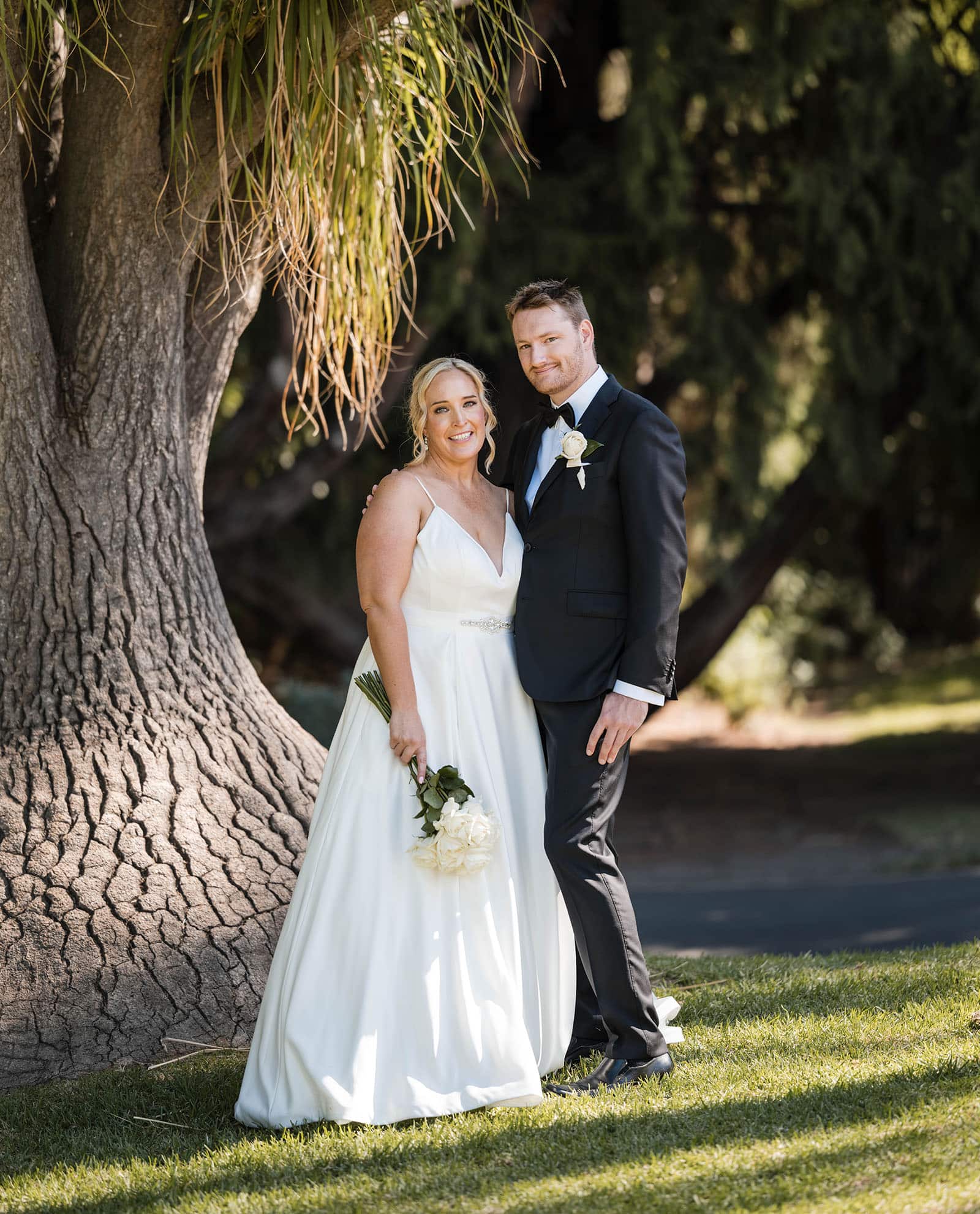 adelaide botanic gardens cycad collection wedding - joanne & blake 29 Bride and groom looking at camera under a funky tree