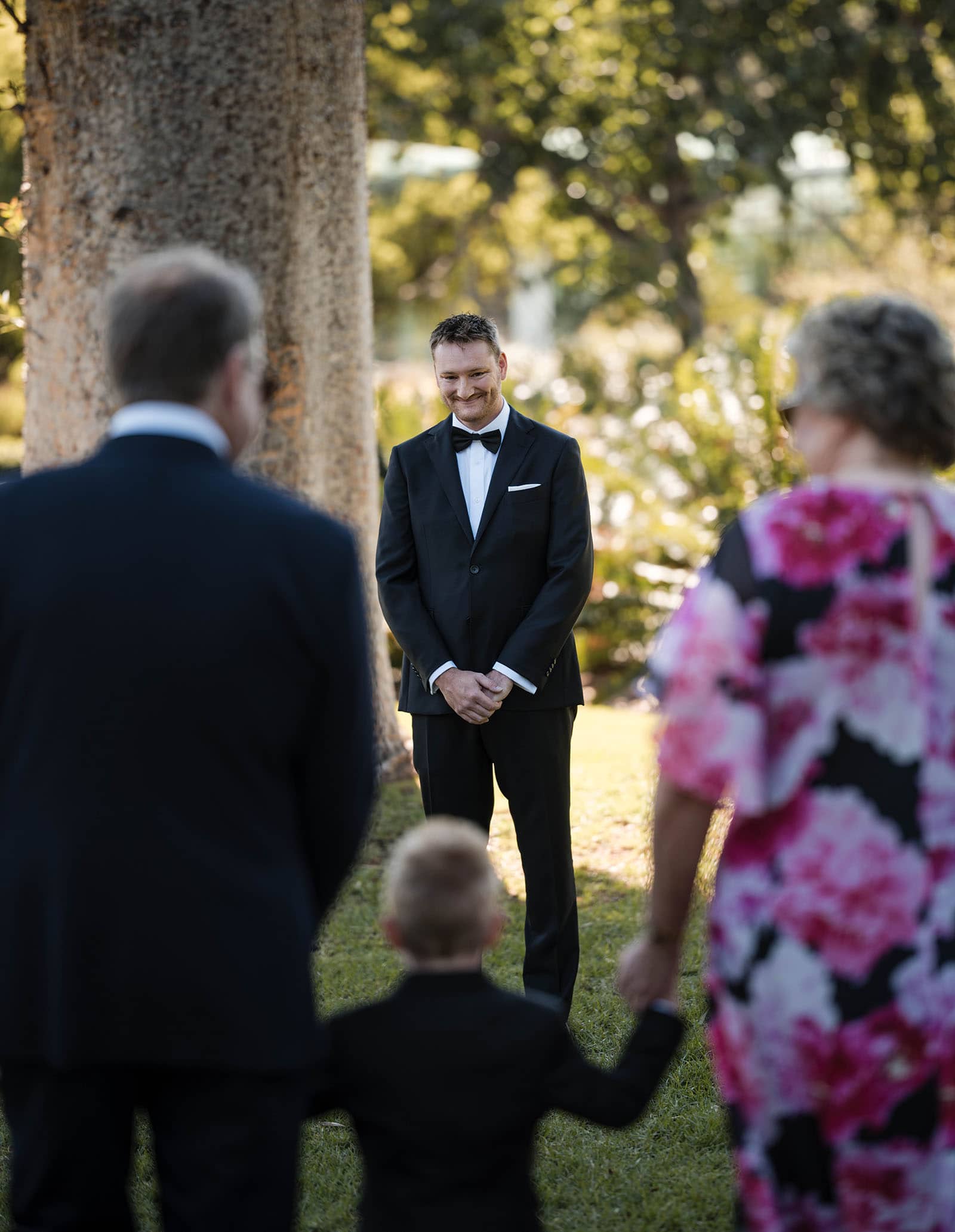 adelaide botanic gardens cycad collection wedding - joanne & blake 3 Groom watching the page boy approach