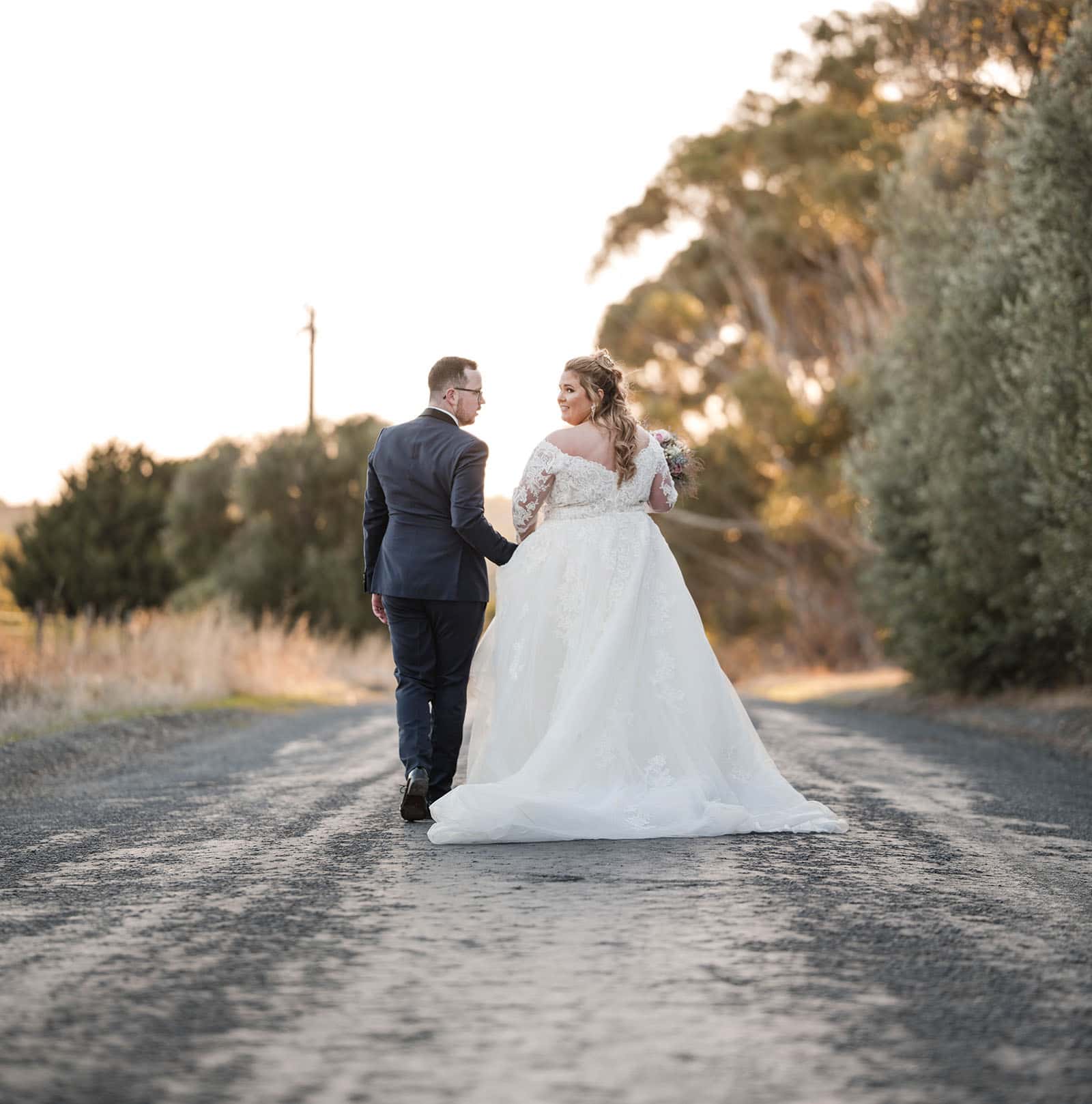 mclaren vale ekhidna wines wedding - kait & brayden 46 bridal couple walking together on road