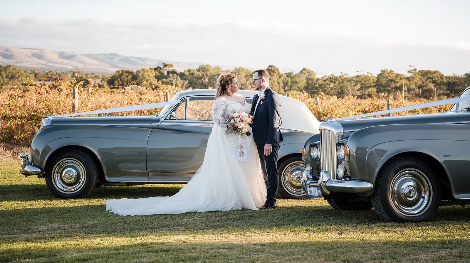 mclaren vale ekhidna wines wedding - kait & brayden 38 Bride and groom amongst their wedding cars