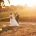 Bride and groom dance at sunset