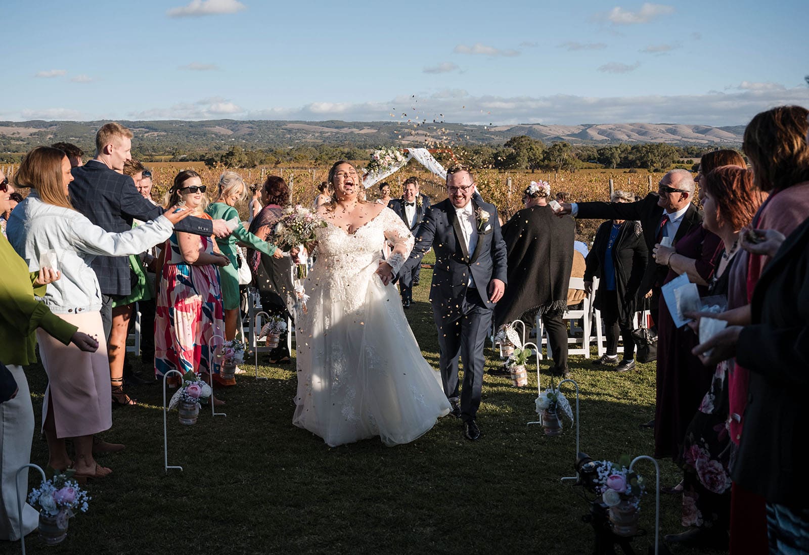 mclaren vale ekhidna wines wedding - kait & brayden 35 bride and groom exiting their Wedding ceremony