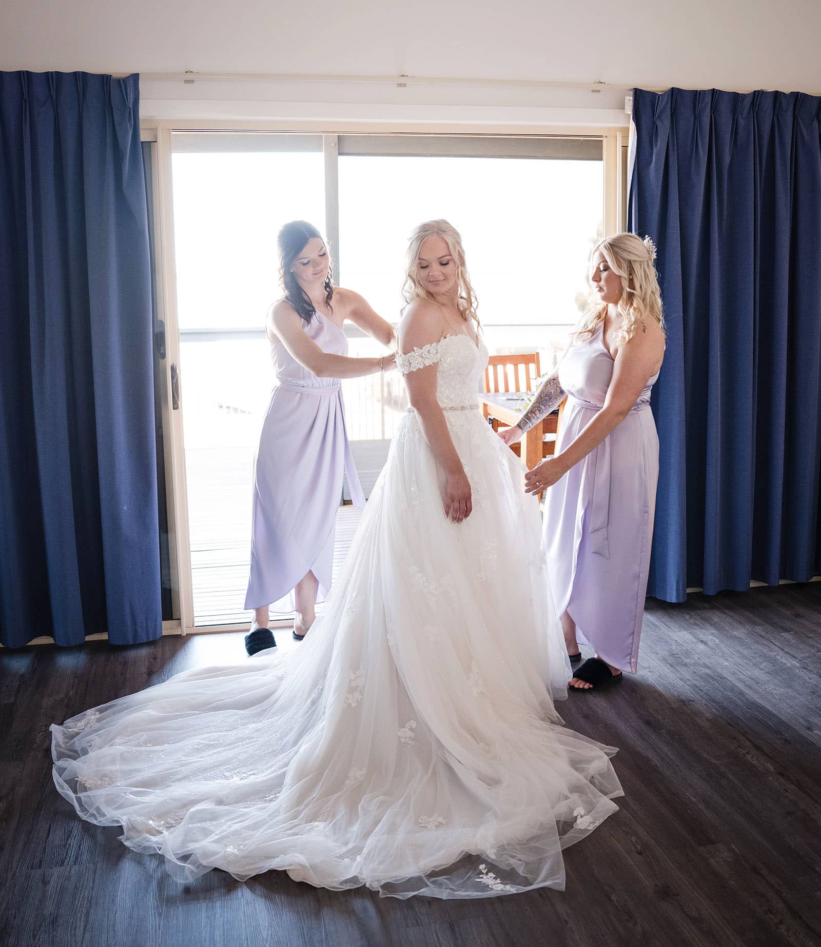 whyalla golf club wedding - tayla & stuart 16 Bridesmaids helping put on gown