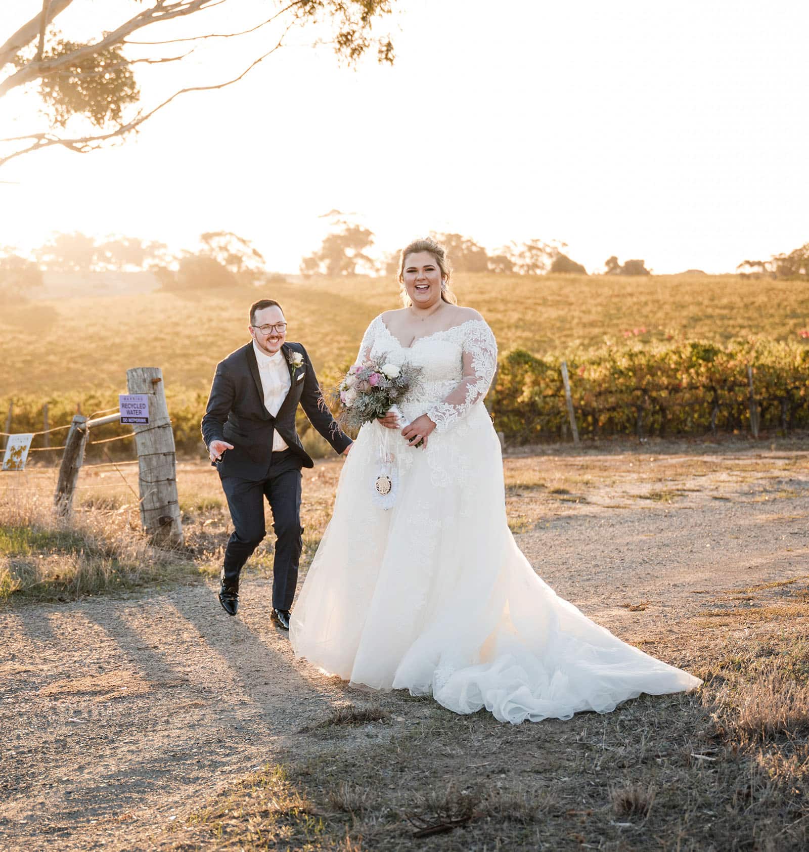 mclaren vale ekhidna wines wedding - kait & brayden 49 groom sneaking up on bride