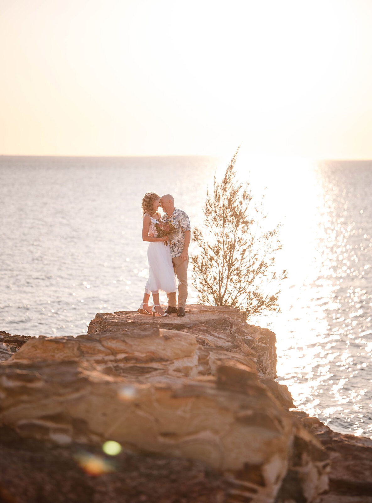 darwin's dudley point wedding - melanie & kerry 35 Bride and groom out on clifftop
