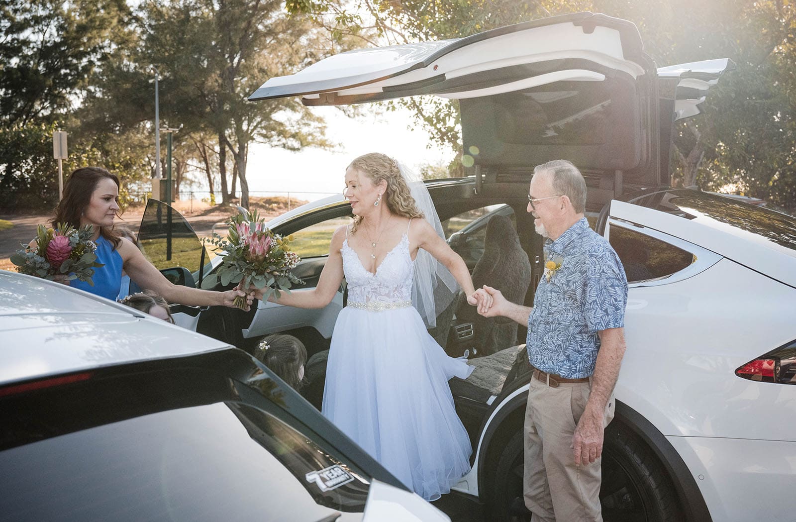 darwin's dudley point wedding - melanie & kerry 22 Bride exiting Tesla