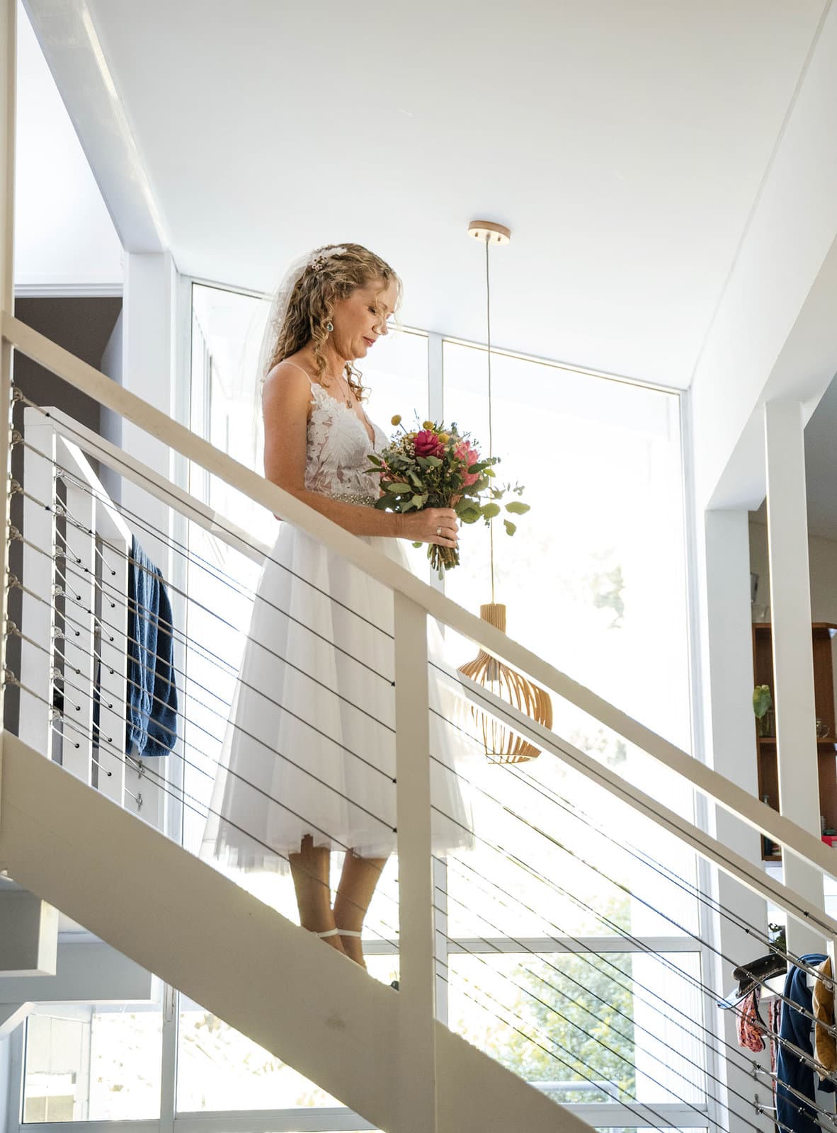 darwin's dudley point wedding - melanie & kerry 18 Bride walking down stairs