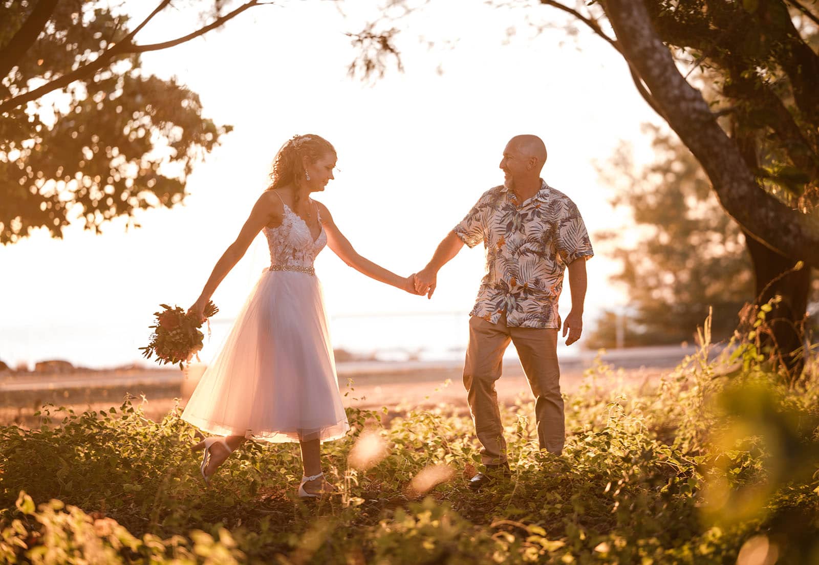 darwin's dudley point wedding - melanie & kerry 43 Groom elading bride through the undergrowth