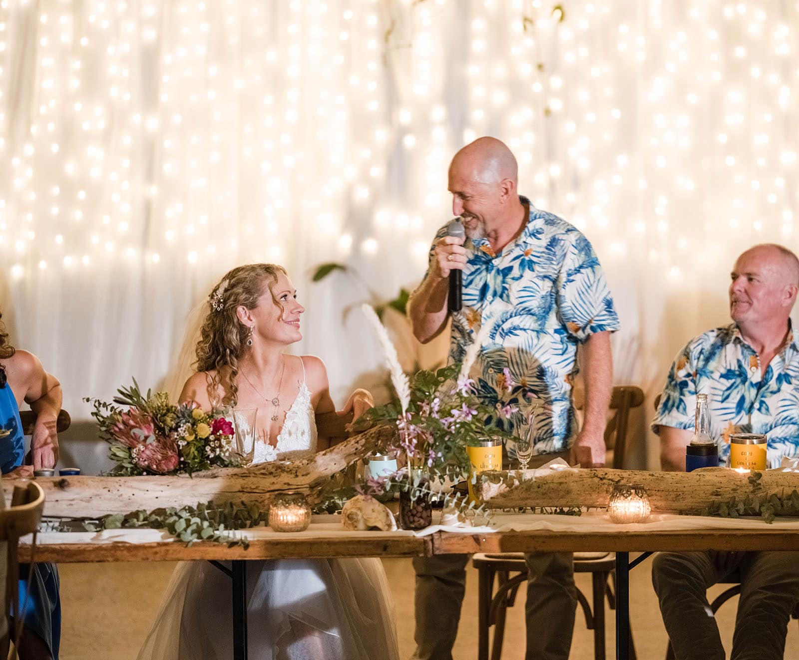 darwin's dudley point wedding - melanie & kerry 53 Grooms speech in front of white backdrop