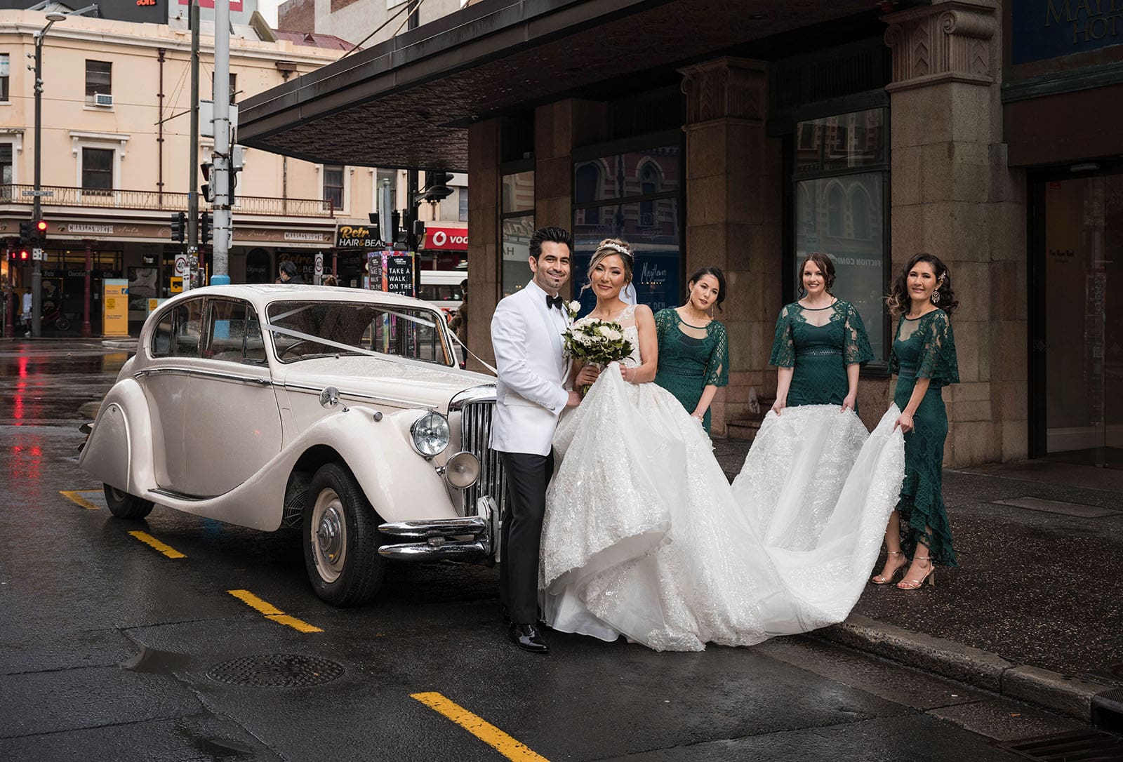 adelaide bridal photoshoot and reception - emre & sara 19 Bridal party with wedding car next to Mayfair Hotel