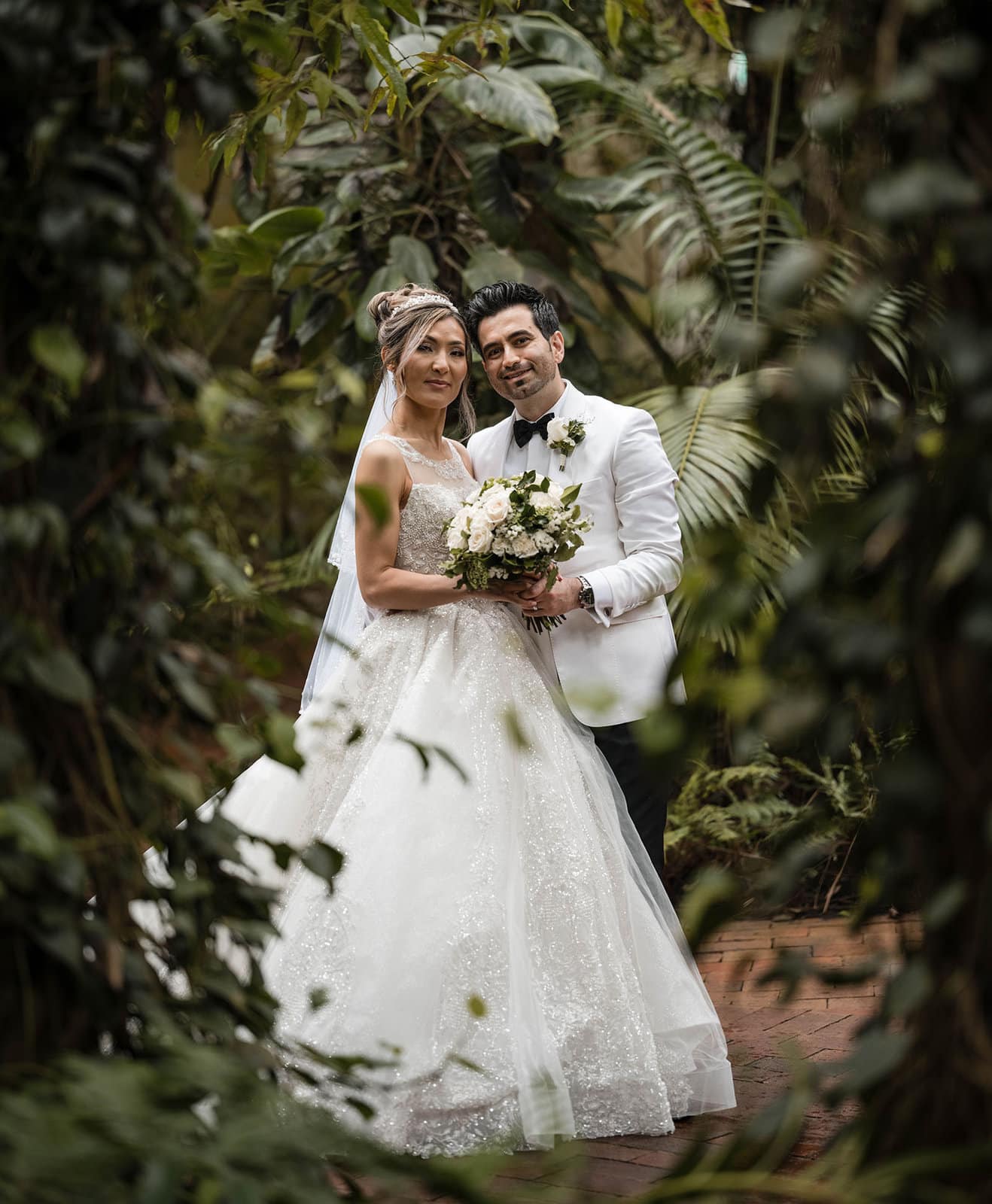 adelaide bridal photoshoot and reception - emre & sara 31 Bride and groom framed by foliage