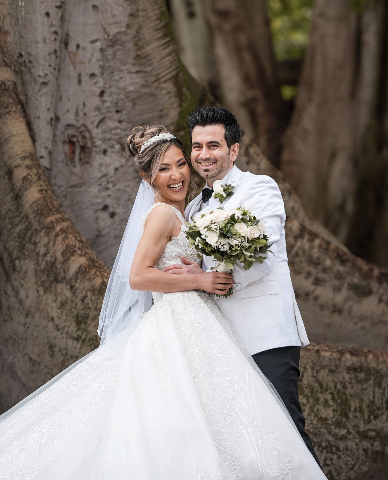adelaide bridal photoshoot and reception - emre & sara 23 Bride and groom holding one another in Botanic Park