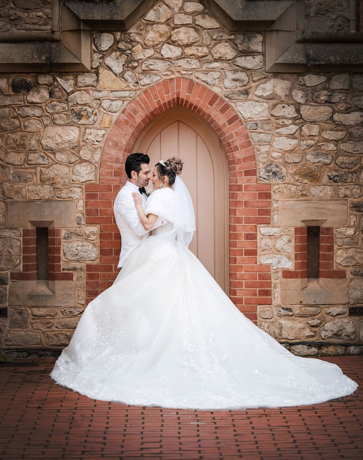 adelaide bridal photoshoot and reception - emre & sara 40 Bride and groom in doorway at the old Adelaide Police Barracks