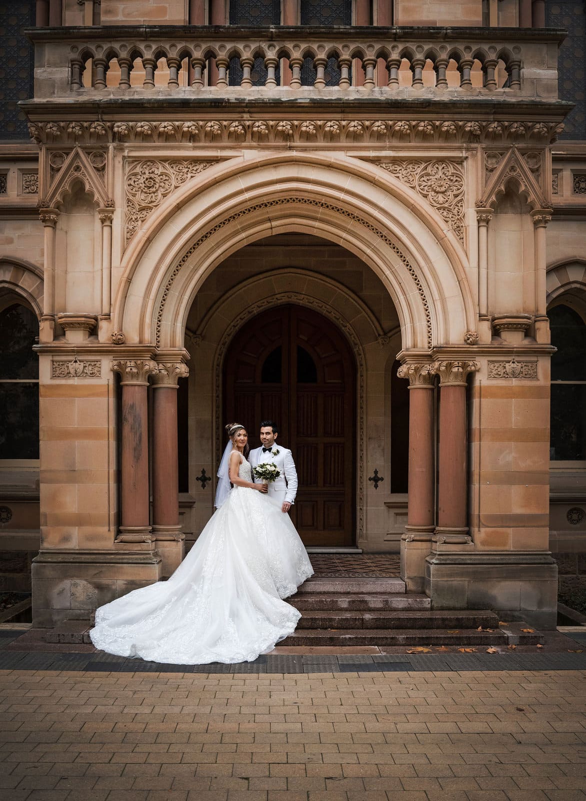 adelaide bridal photoshoot and reception - emre & sara 33 Bride and groom in front of ornate doorway