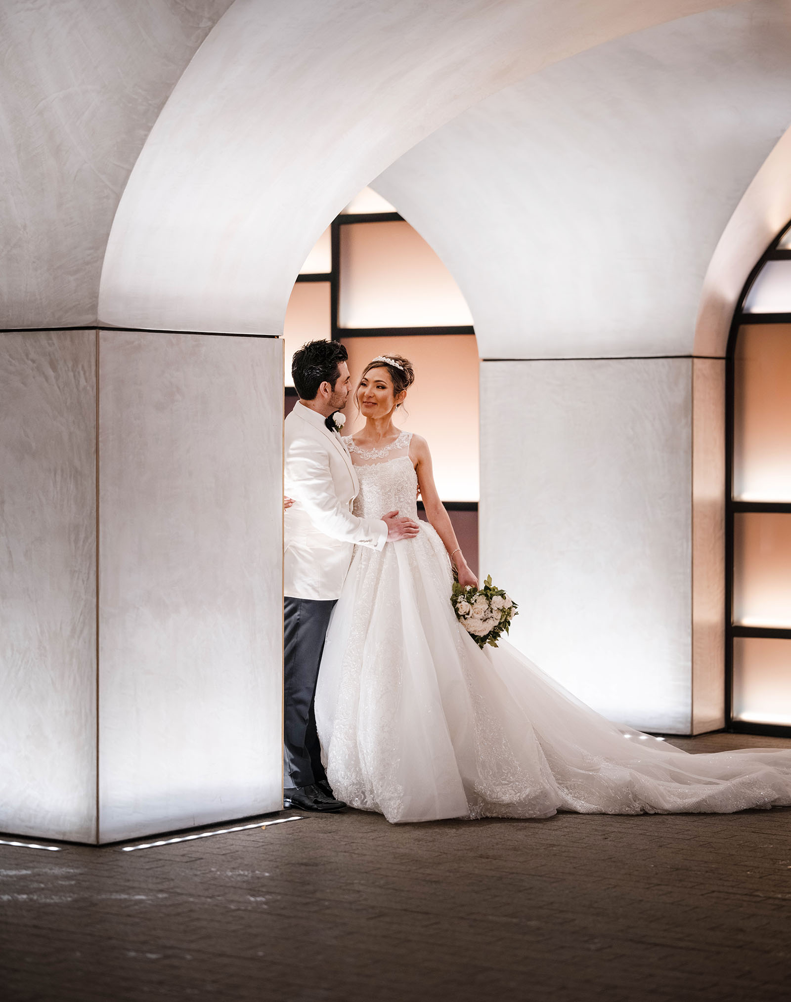 adelaide bridal photoshoot and reception - emre & sara 49 Bride and groom in the pillars of the Adelaide Railway Station