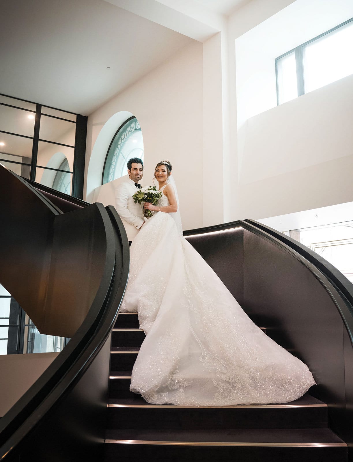 adelaide bridal photoshoot and reception - emre & sara 16 Bride and groom on Mayfair Hotel's staircase