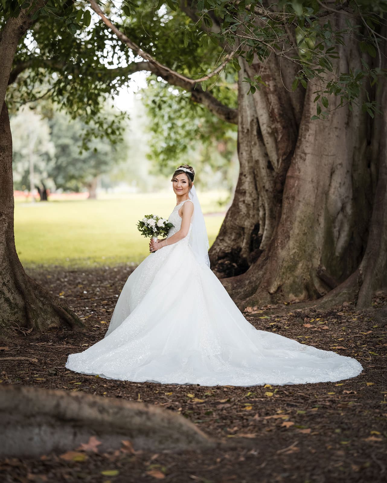 adelaide bridal photoshoot and reception - emre & sara 26 Bride standing aloe with long wedding gown train