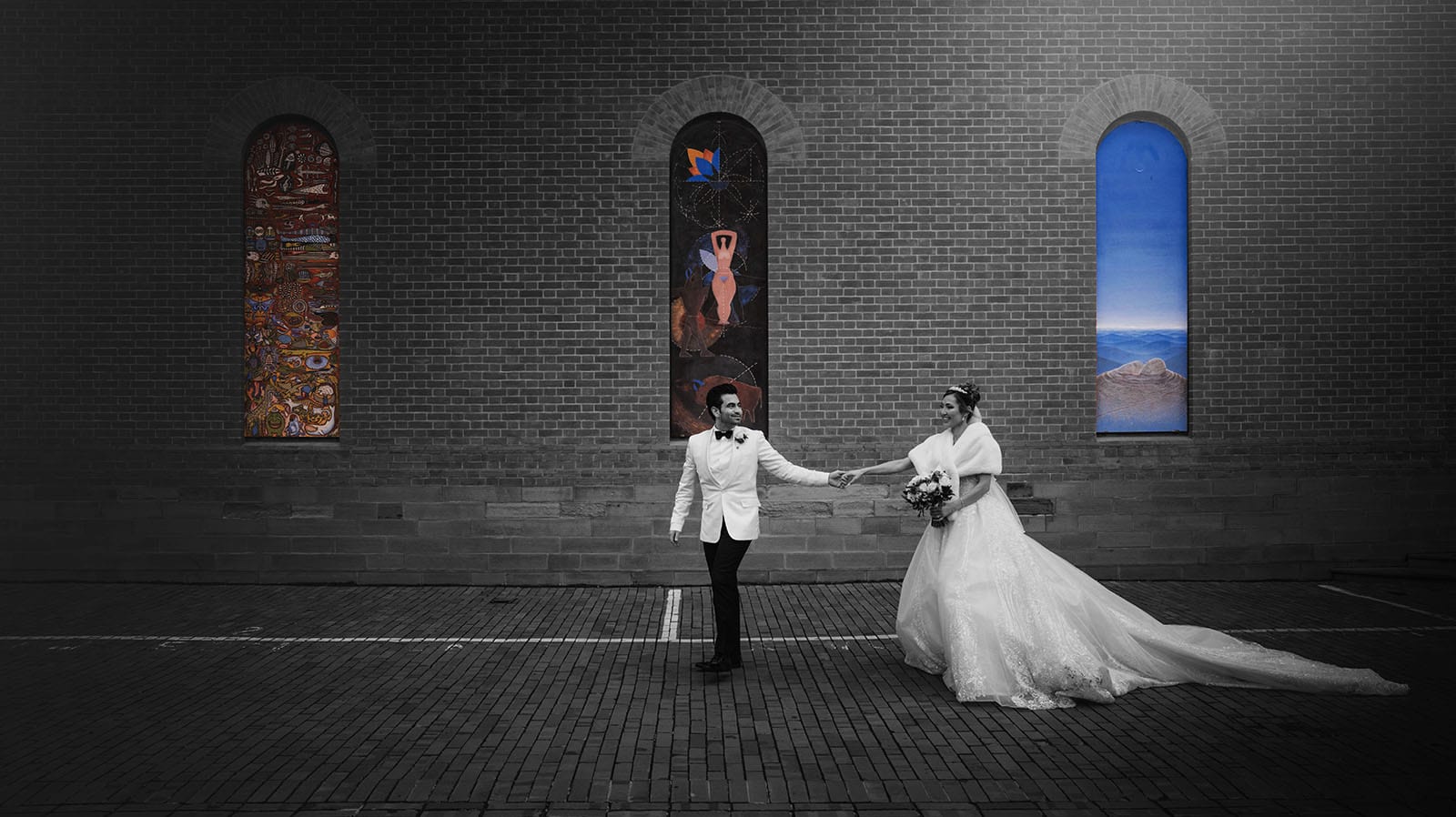adelaide bridal photoshoot and reception - emre & sara 37 groom leading bride in front of artwork