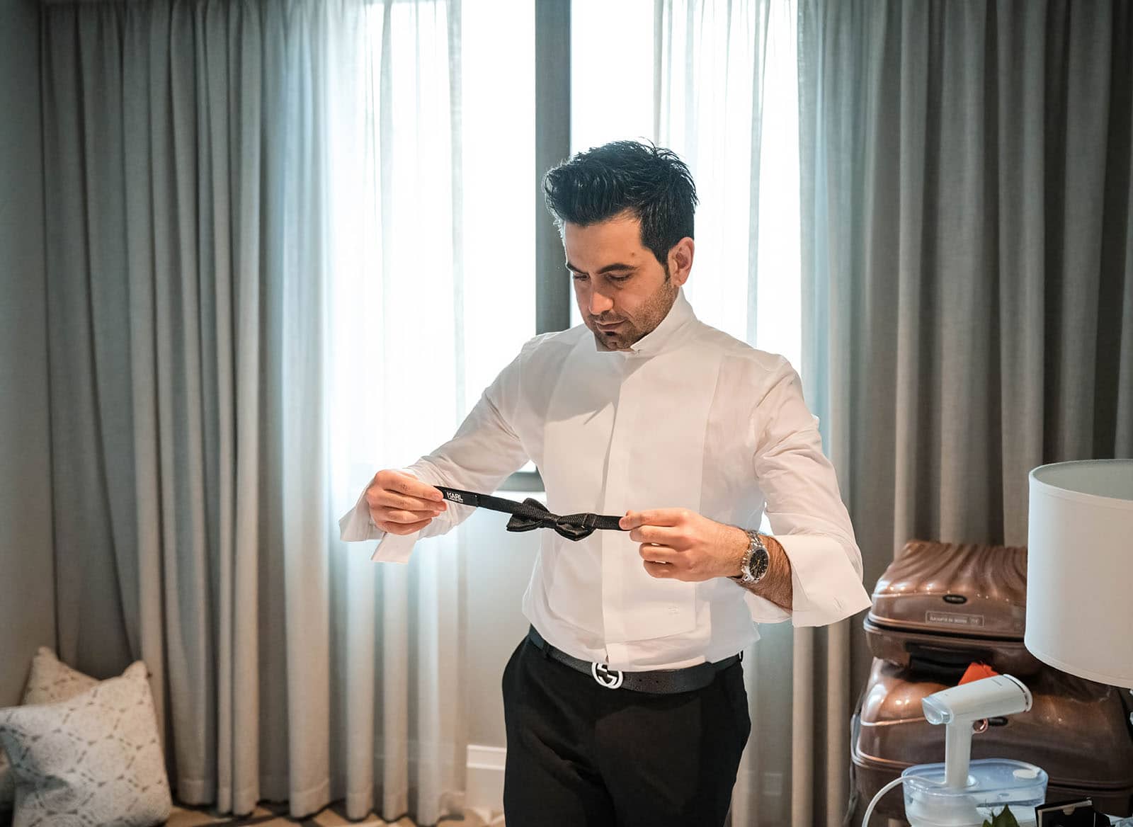 adelaide bridal photoshoot and reception - emre & sara 13 Groom surveying bowtie