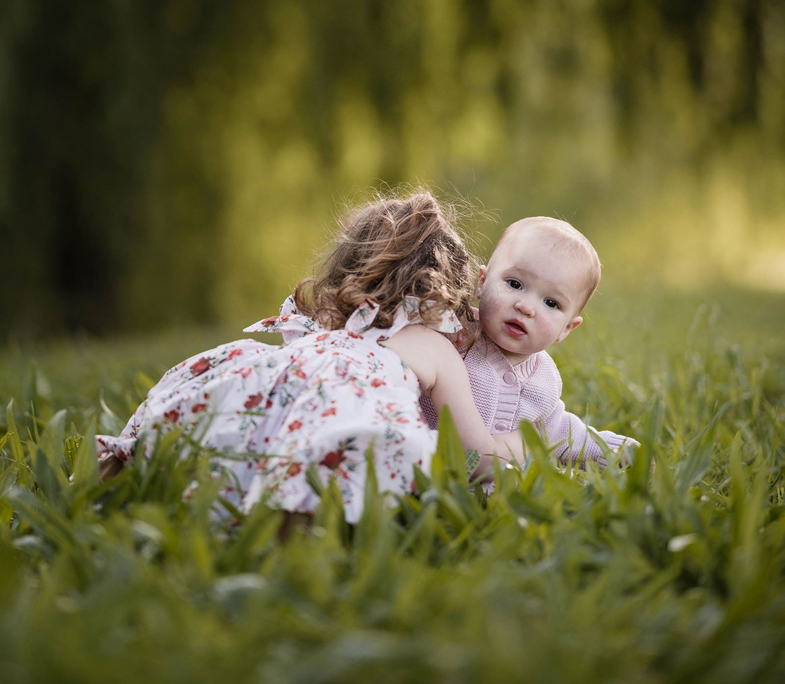 fountain valley reserve family shoot - shaw family 1 Two sisters playing in grass